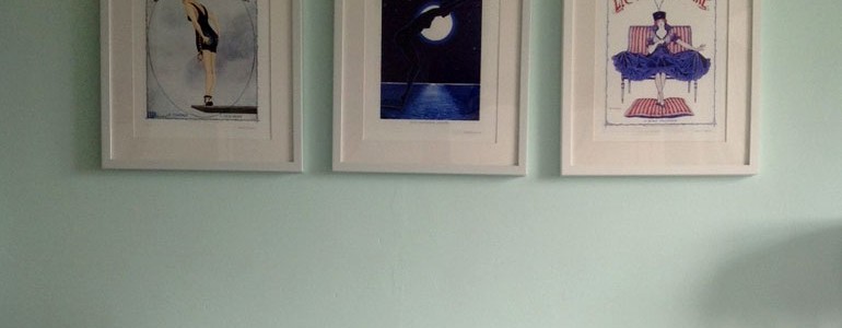 A collection of prints in the bedroom