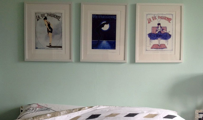 A collection of prints in the bedroom
